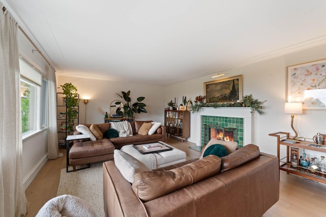 2514 Branch St, Duluth, MN 55812 - living room with light wood-type flooring, a tiled fireplace, and ornamental molding