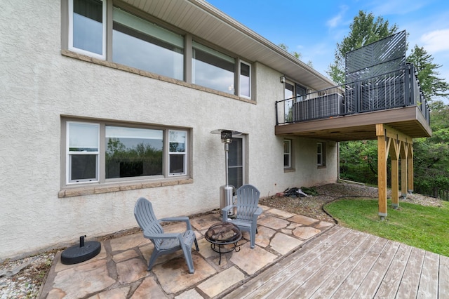 2514 Branch St, Duluth, MN 55812 - wooden terrace with a patio and a fire pit