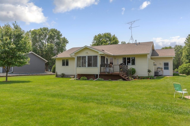 4820 Echo Ct, Faribault, MN 55021 - back of house featuring a sunroom, a yard, stairway, a wooden deck, and a shingled roof