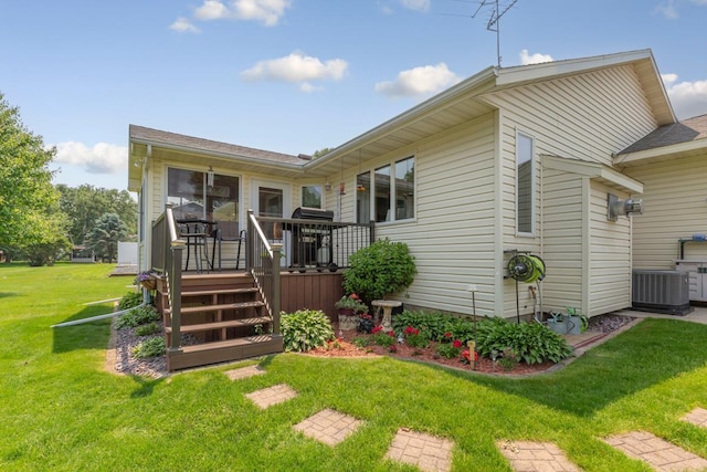 4820 Echo Ct, Faribault, MN 55021 - view of front of house with a wooden deck, a front lawn, and roof with shingles