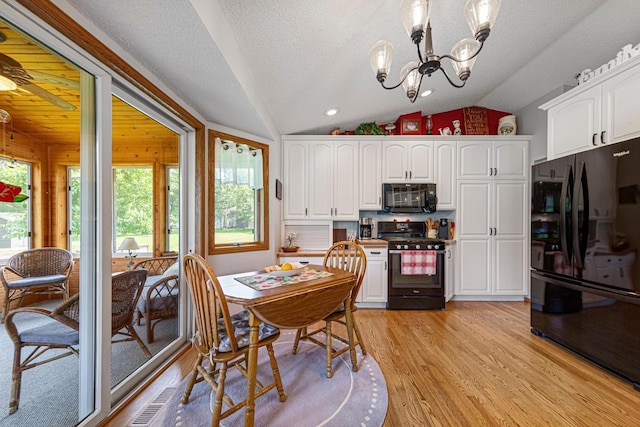 4820 Echo Ct, Faribault, MN 55021 - dining space with healthy amount of natural light, lofted ceiling, light wood finished floors, and a chandelier