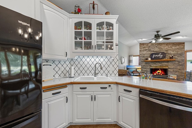 4820 Echo Ct, Faribault, MN 55021 - kitchen with dishwasher, a textured ceiling, refrigerator, tasteful backsplash, and open floor plan