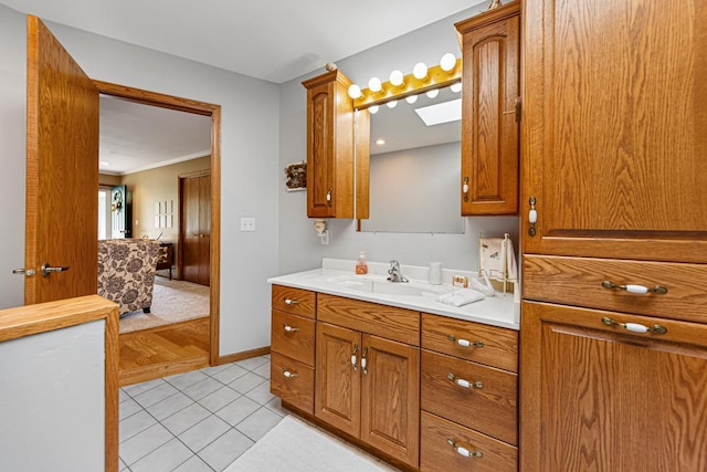 4820 Echo Ct, Faribault, MN 55021 - bathroom featuring vanity, crown molding, and tile patterned flooring