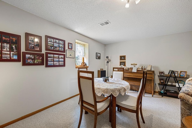 4820 Echo Ct, Faribault, MN 55021 - dining space with light colored carpet and a textured ceiling