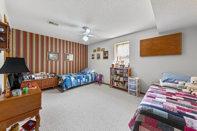 4820 Echo Ct, Faribault, MN 55021 - carpeted bedroom with a textured ceiling, a ceiling fan, and wallpapered walls