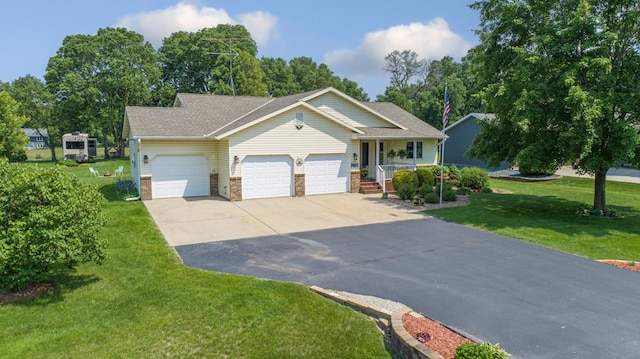 4820 Echo Ct, Faribault, MN 55021 - view of front of property featuring covered porch, an attached garage, concrete driveway, a front lawn, and brick siding