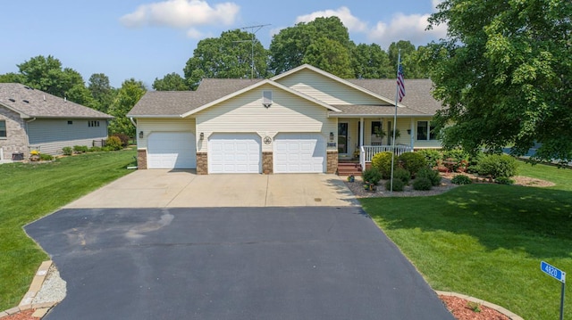 4820 Echo Ct, Faribault, MN 55021 - view of front facade featuring an attached garage, covered porch, a front yard, driveway, and brick siding