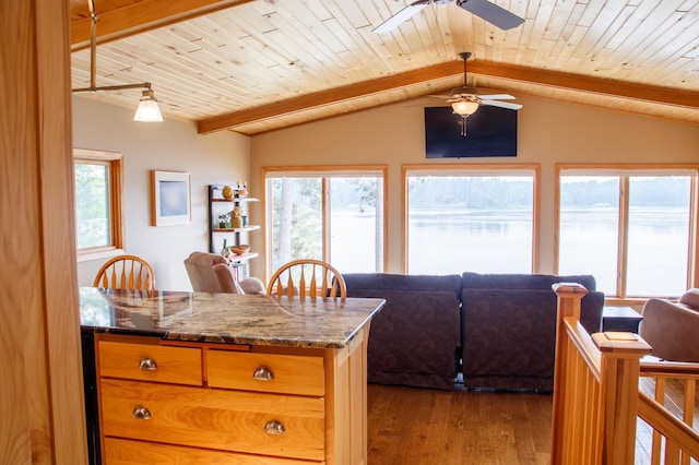 36945 Delta Bay Rd, Pine River, MN 56474 - kitchen featuring open floor plan, ceiling fan, wood finished floors, wooden ceiling, and stone countertops