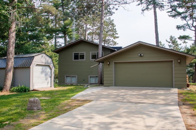 36945 Delta Bay Rd, Pine River, MN 56474 - view of front of house featuring an outdoor structure, concrete driveway, and a front yard