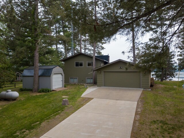 36945 Delta Bay Rd, Pine River, MN 56474 - view of front of house featuring a front lawn and a shed