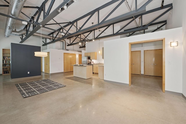 111 Franklin Ave Unit 215, Minneapolis, MN 55404 - unfurnished living room with a towering ceiling and concrete floors