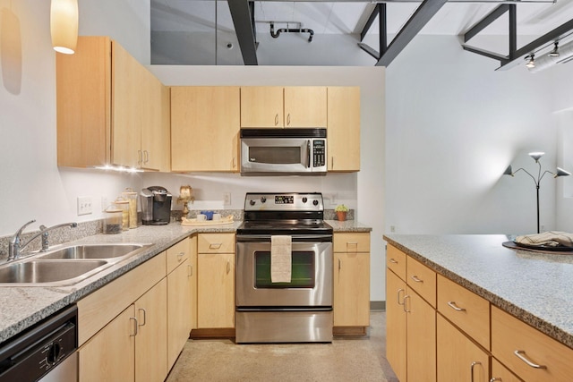 111 Franklin Ave Unit 215, Minneapolis, MN 55404 - kitchen featuring stainless steel appliances and light brown cabinetry