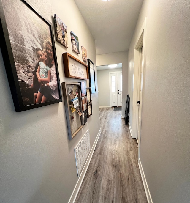 534 Main St, Perham, MN 56573 - corridor featuring wood finished floors and baseboards