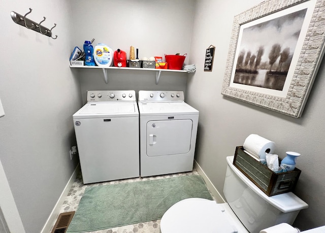 534 Main St, Perham, MN 56573 - laundry area with washer and clothes dryer and baseboards