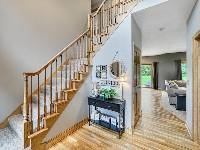 1847 140th Ln NE, Ham Lake, MN 55304 - stairway with wood finished floors and baseboards