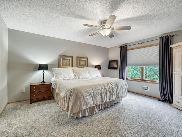 1847 140th Ln NE, Ham Lake, MN 55304 - bedroom with light colored carpet, a textured ceiling, and ceiling fan