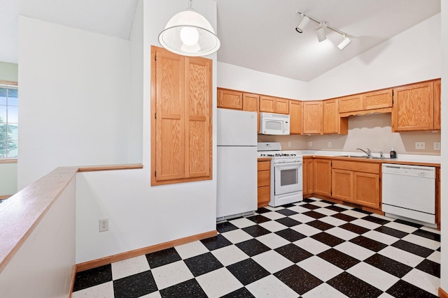 15616 84th St NE, Otsego, MN 55330 - kitchen featuring white appliances, dark floors, vaulted ceiling, rail lighting, and light countertops