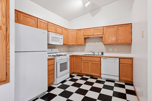 15616 84th St NE, Otsego, MN 55330 - kitchen featuring white appliances, dark flooring, lofted ceiling, and light countertops
