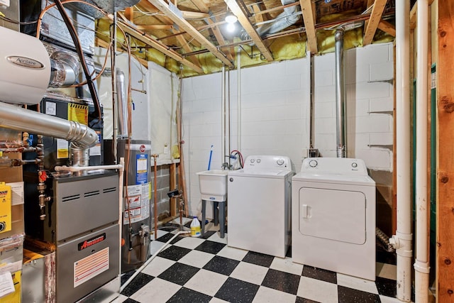 15616 84th St NE, Otsego, MN 55330 - washroom featuring washing machine and dryer, tile patterned floors, and water heater
