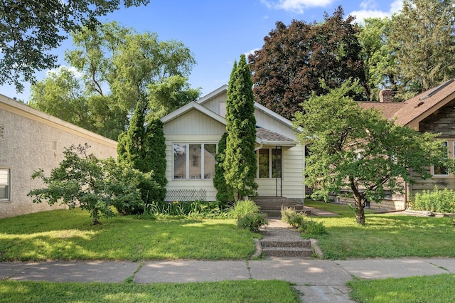 3521 26th St, Minneapolis, MN 55406 - view of front of property featuring a front lawn and roof with shingles