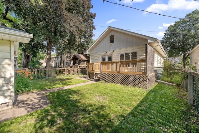 3521 26th St, Minneapolis, MN 55406 - rear view of house featuring a fenced backyard and a wooden deck