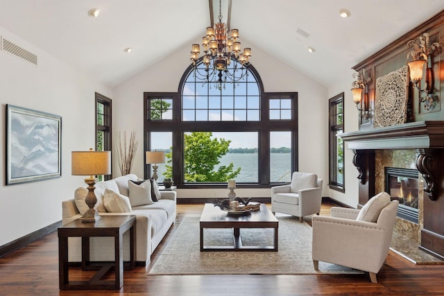 1709 1/2 Pulaski Rd, Buffalo, MN 55313 - living room with a premium fireplace, healthy amount of natural light, a chandelier, wood finished floors, and high vaulted ceiling
