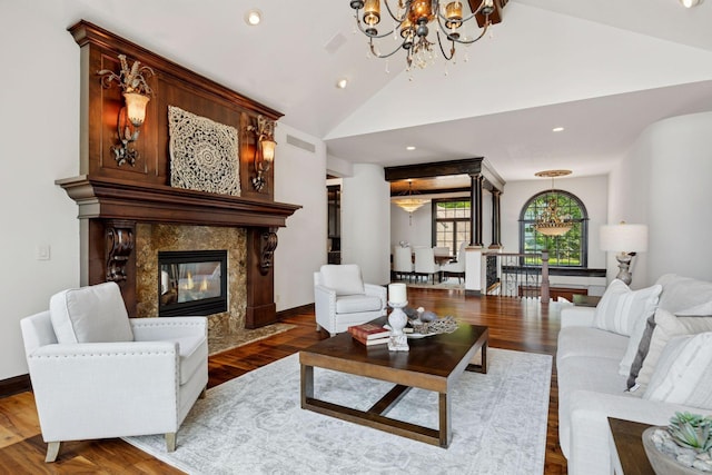 1709 1/2 Pulaski Rd, Buffalo, MN 55313 - living area featuring a chandelier, a fireplace, lofted ceiling, wood finished floors, and recessed lighting