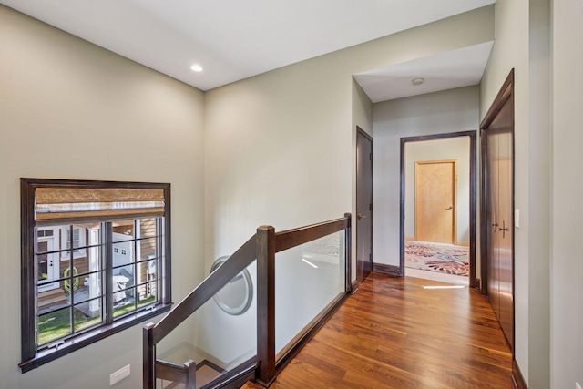 1709 1/2 Pulaski Rd, Buffalo, MN 55313 - hallway with dark wood-style floors, an upstairs landing, and recessed lighting