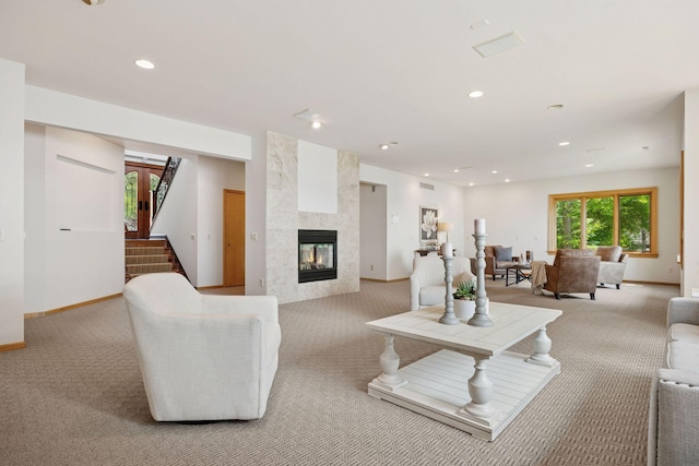 1709 1/2 Pulaski Rd, Buffalo, MN 55313 - living room featuring light carpet, a fireplace, recessed lighting, and stairway
