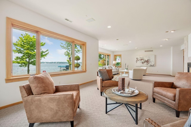 1709 1/2 Pulaski Rd, Buffalo, MN 55313 - carpeted living room featuring a water view and recessed lighting
