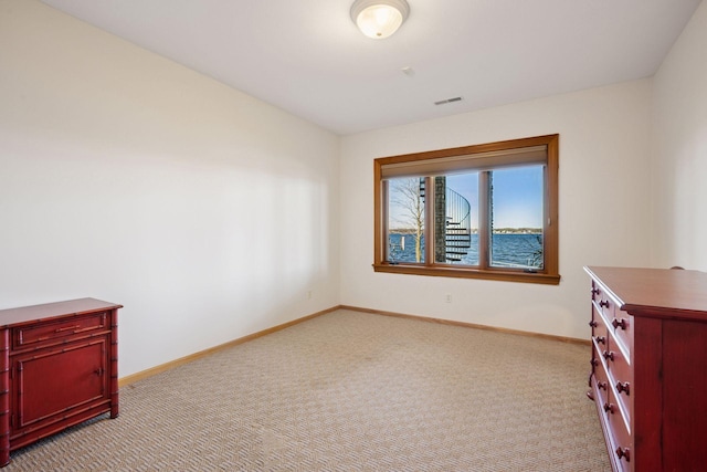 1709 1/2 Pulaski Rd, Buffalo, MN 55313 - spare room featuring light colored carpet and baseboards