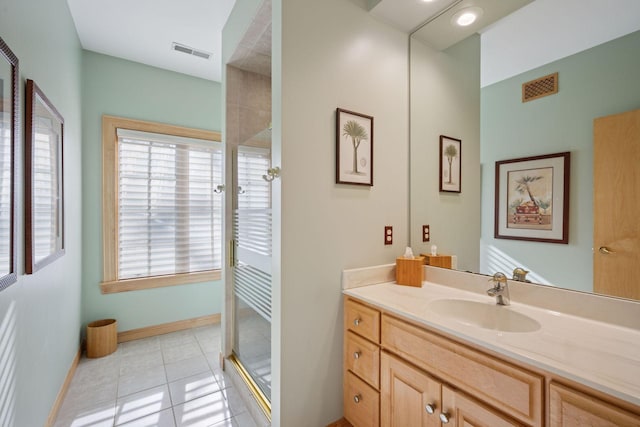 1709 1/2 Pulaski Rd, Buffalo, MN 55313 - bathroom featuring vanity, tile patterned flooring, and a stall shower