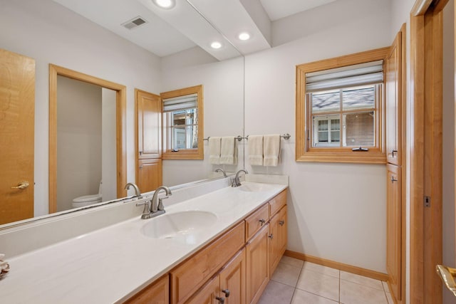 1709 1/2 Pulaski Rd, Buffalo, MN 55313 - bathroom featuring double vanity, recessed lighting, and tile patterned floors