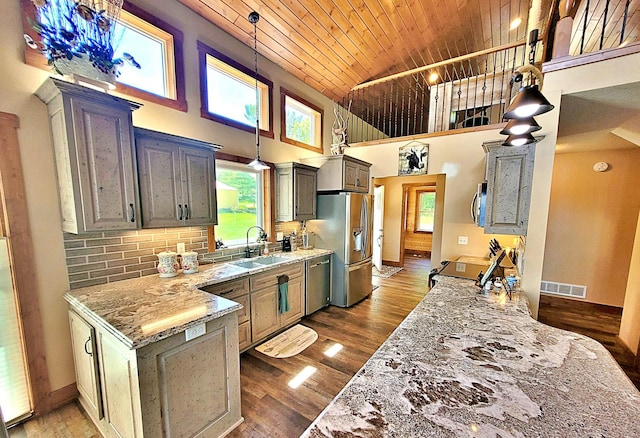 45207 281st Ln, Aitkin, MN 56431 - kitchen with appliances with stainless steel finishes, wood ceiling, a high ceiling, dark wood-style floors, and light stone countertops