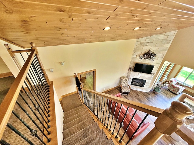 45207 281st Ln, Aitkin, MN 56431 - stairs with wooden ceiling, a stone fireplace, lofted ceiling, wood finished floors, and recessed lighting
