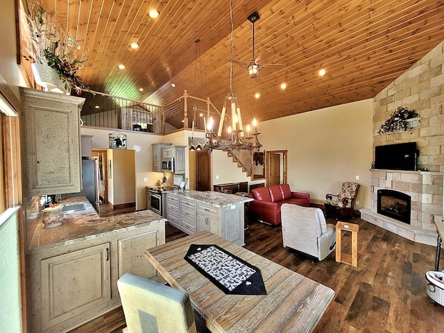 45207 281st Ln, Aitkin, MN 56431 - dining space featuring wood ceiling, a stone fireplace, dark wood finished floors, stairs, and a chandelier