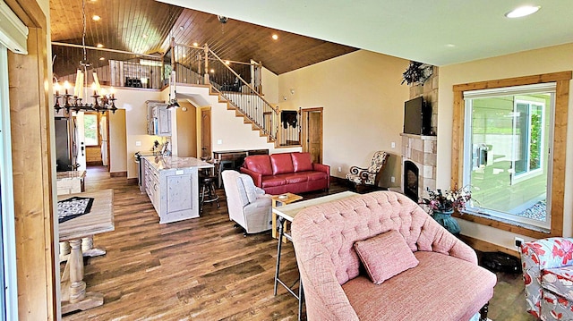 45207 281st Ln, Aitkin, MN 56431 - living room featuring stairs, wood finished floors, high vaulted ceiling, a chandelier, and recessed lighting