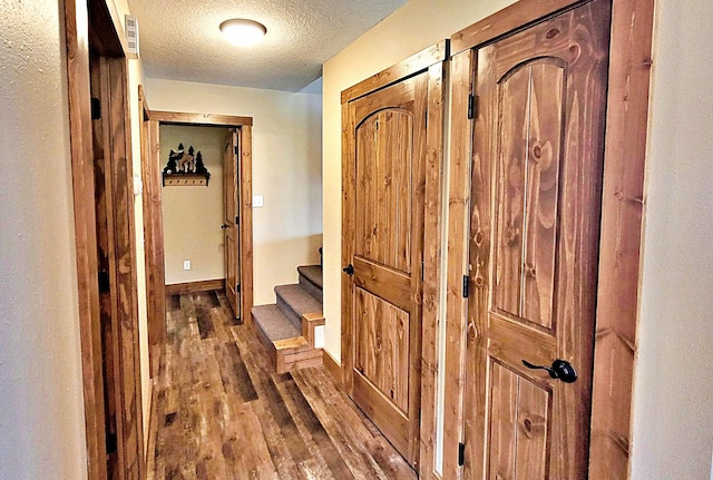 45207 281st Ln, Aitkin, MN 56431 - corridor with wood finished floors, a textured ceiling, and stairs