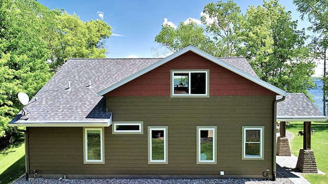 45207 281st Ln, Aitkin, MN 56431 - view of property exterior featuring a shingled roof and a lawn