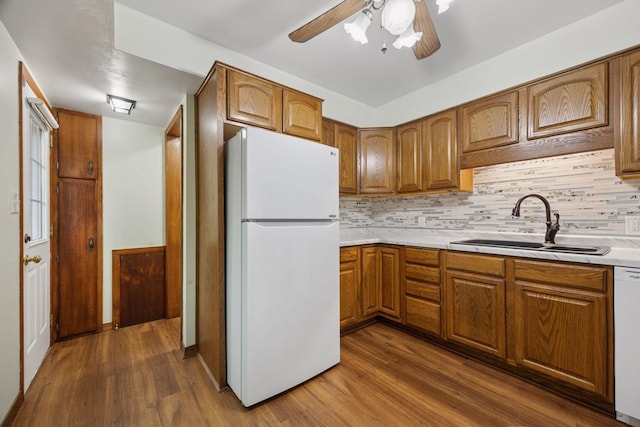 1864 Morgan Ave, Saint Paul, MN 55116 - kitchen featuring white appliances, brown cabinets, and dark wood-style flooring