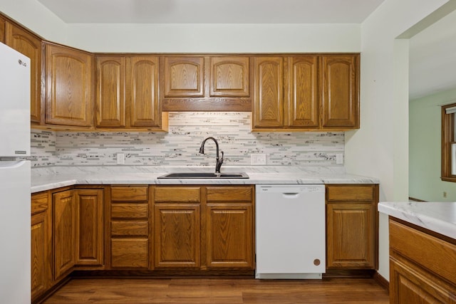 1864 Morgan Ave, Saint Paul, MN 55116 - kitchen with white appliances, dark wood finished floors, tasteful backsplash, and brown cabinets