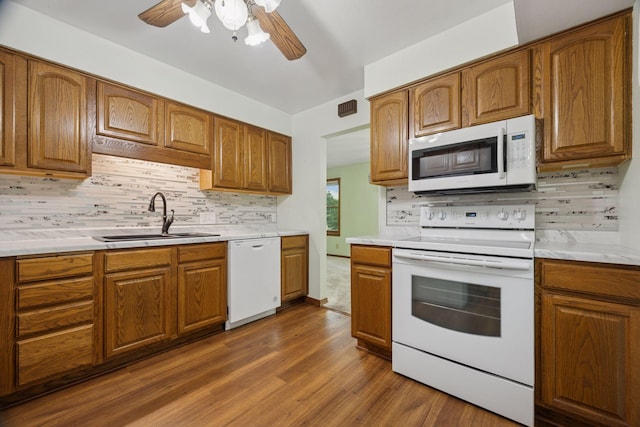 1864 Morgan Ave, Saint Paul, MN 55116 - kitchen with white appliances, ceiling fan, dark wood-type flooring, and decorative backsplash