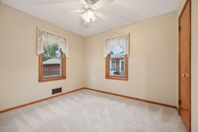 1864 Morgan Ave, Saint Paul, MN 55116 - spare room with healthy amount of natural light, carpet floors, and ceiling fan