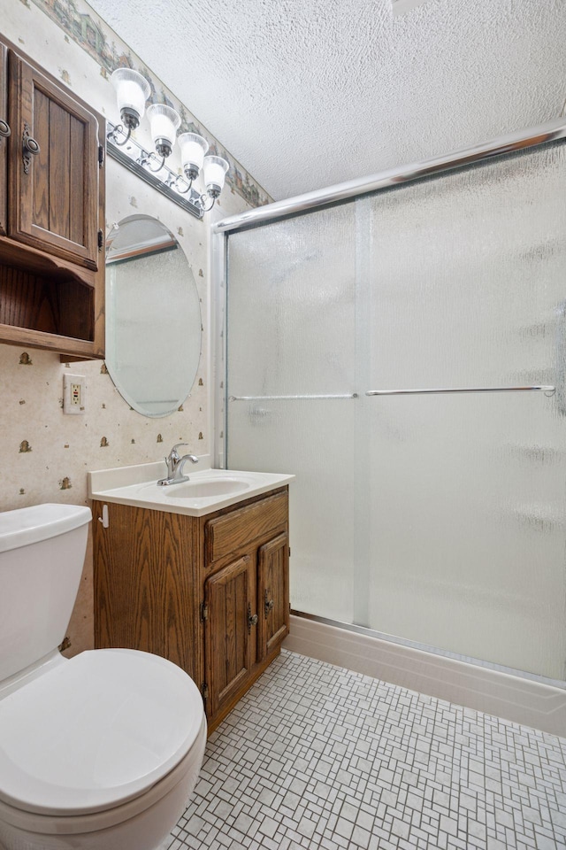 1864 Morgan Ave, Saint Paul, MN 55116 - bathroom with wallpapered walls, a stall shower, vanity, and a textured ceiling