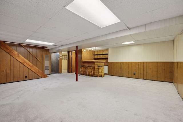 1864 Morgan Ave, Saint Paul, MN 55116 - finished basement featuring a dry bar, wooden walls, stairway, carpet, and a paneled ceiling
