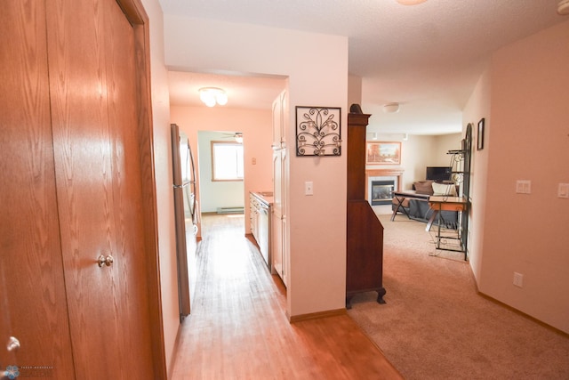 2515 25th St S Unit 303H, Fargo, ND 58103 - hallway with a baseboard heating unit and light wood-style flooring