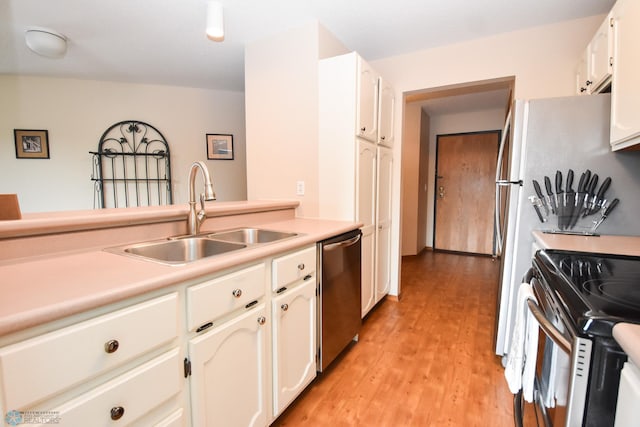 2515 25th St S Unit 303H, Fargo, ND 58103 - kitchen featuring stainless steel appliances, white cabinets, light wood-style flooring, and light countertops