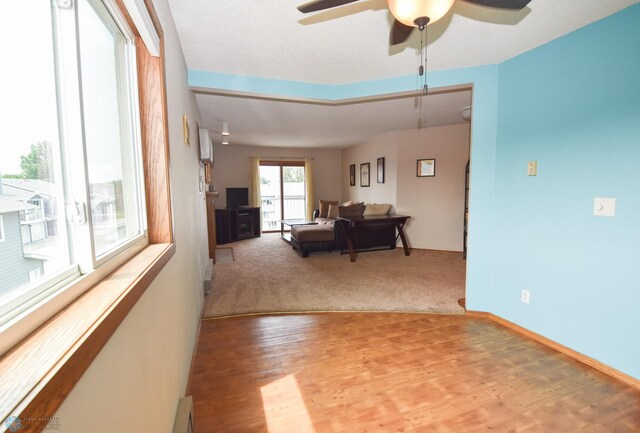 2515 25th St S Unit 303H, Fargo, ND 58103 - living room with wood finished floors and ceiling fan