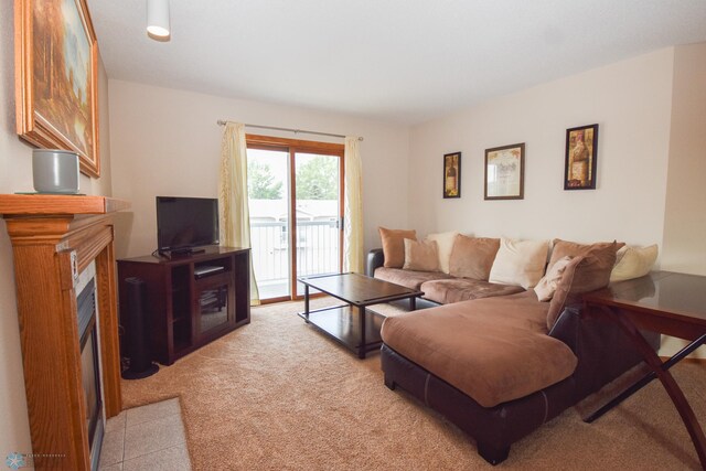 2515 25th St S Unit 303H, Fargo, ND 58103 - living area featuring a fireplace with flush hearth and light colored carpet
