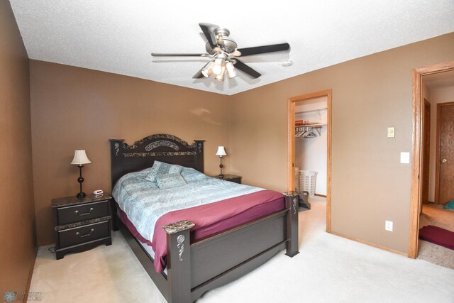 2515 25th St S Unit 303H, Fargo, ND 58103 - carpeted bedroom with a spacious closet, a closet, and a ceiling fan